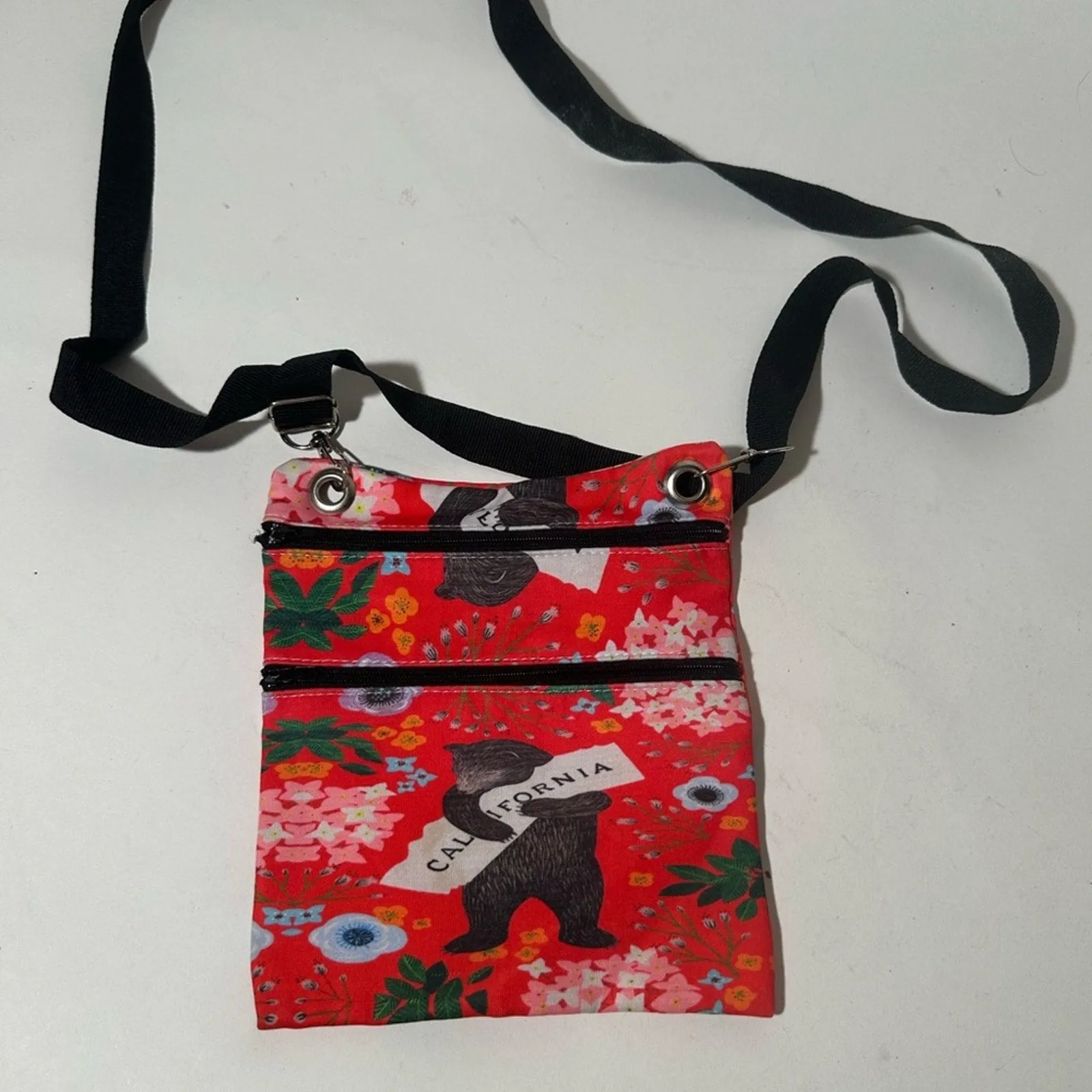 Red and Black Crossbody Bag with Artistic Design