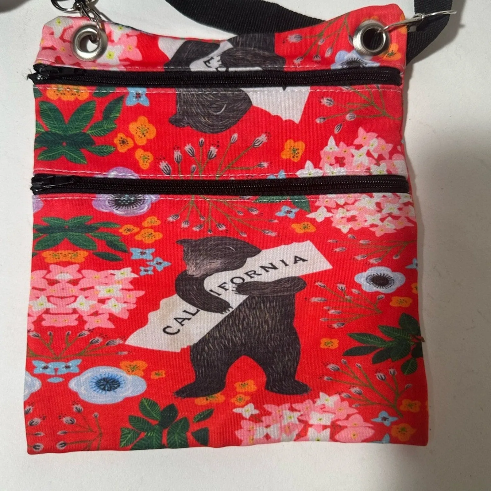 Red and Black Crossbody Bag with Artistic Design