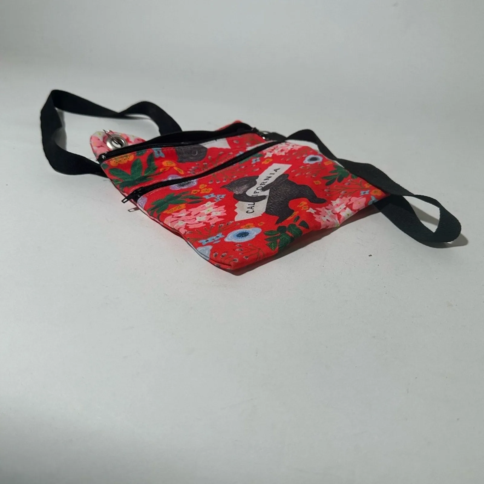 Red and Black Crossbody Bag with Artistic Design