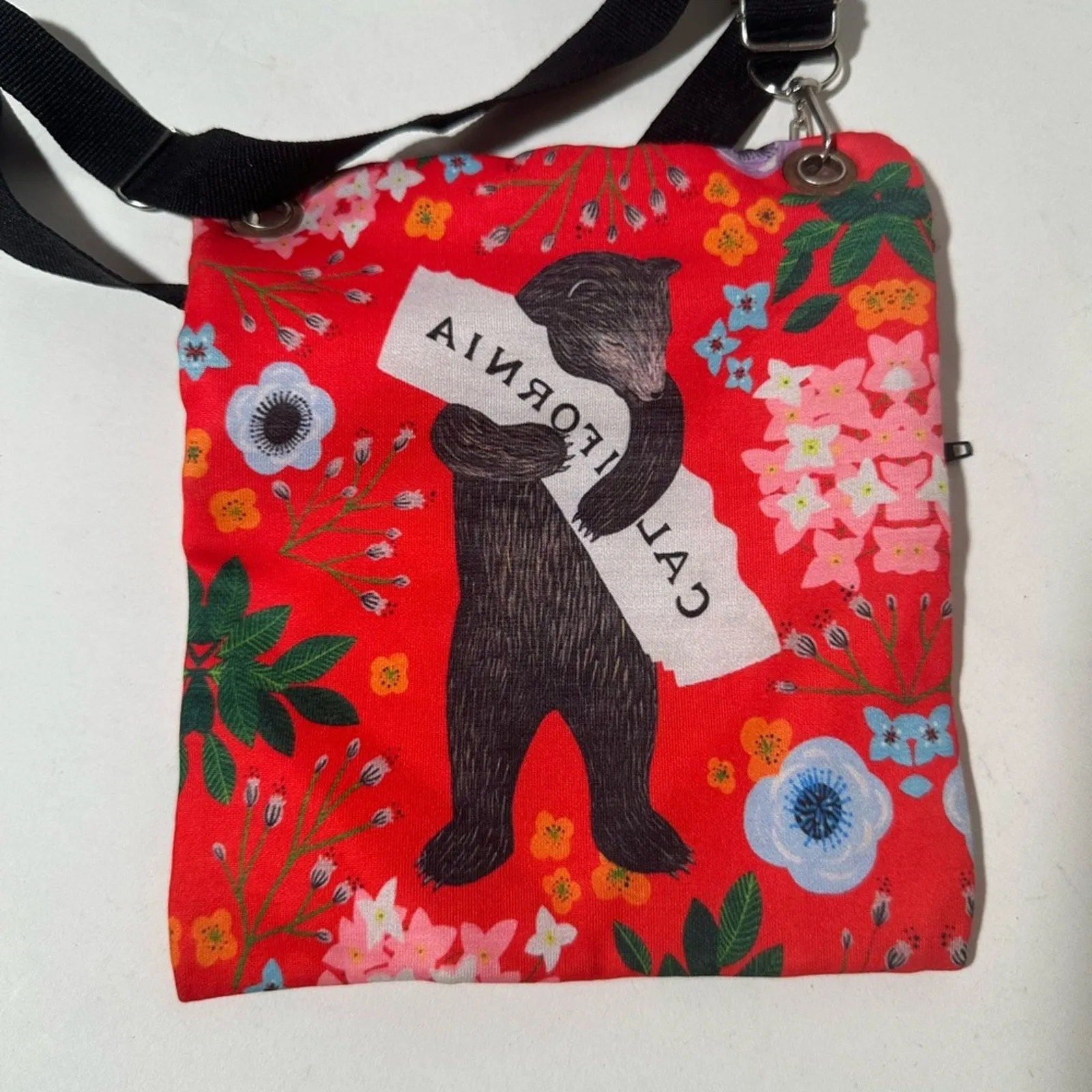 Red and Black Crossbody Bag with Artistic Design