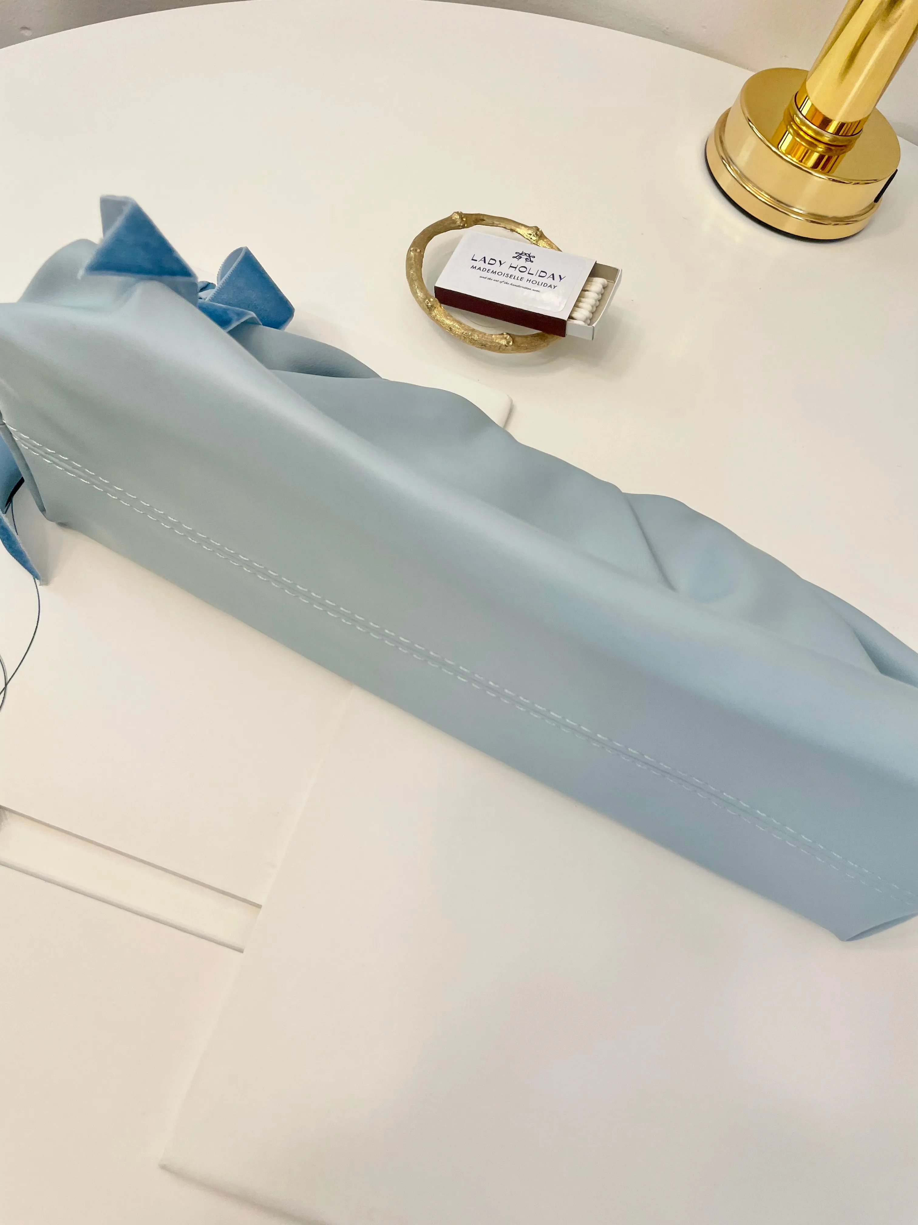 The most feminine soft blue tassel clutch bag... so lovely