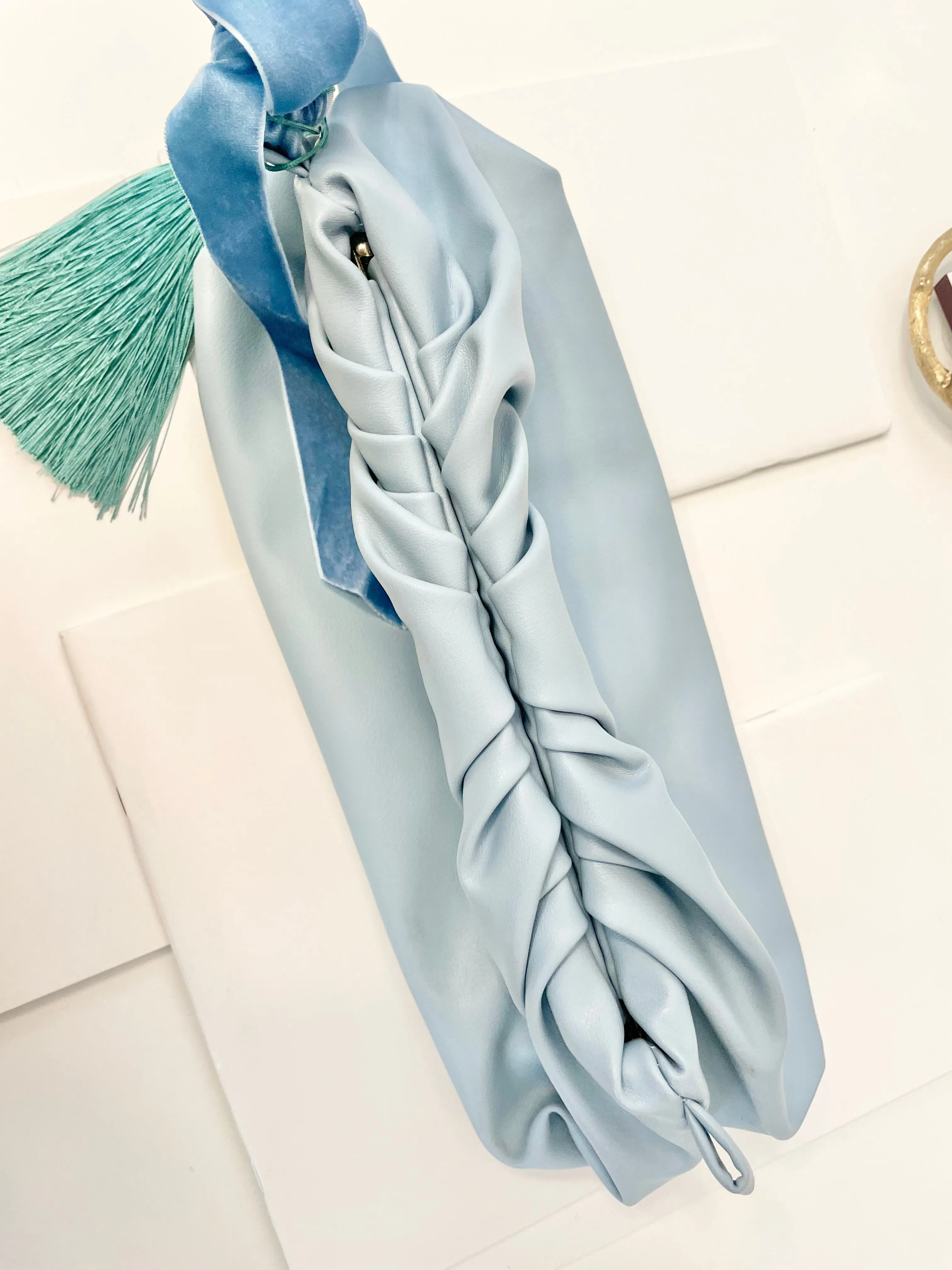 The most feminine soft blue tassel clutch bag... so lovely