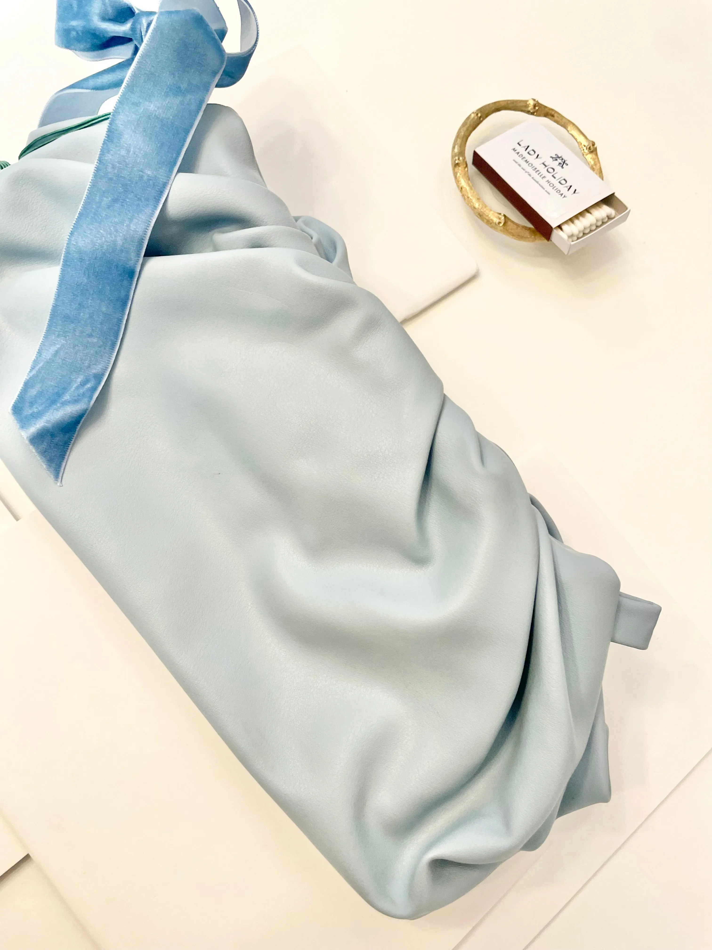 The most feminine soft blue tassel clutch bag... so lovely