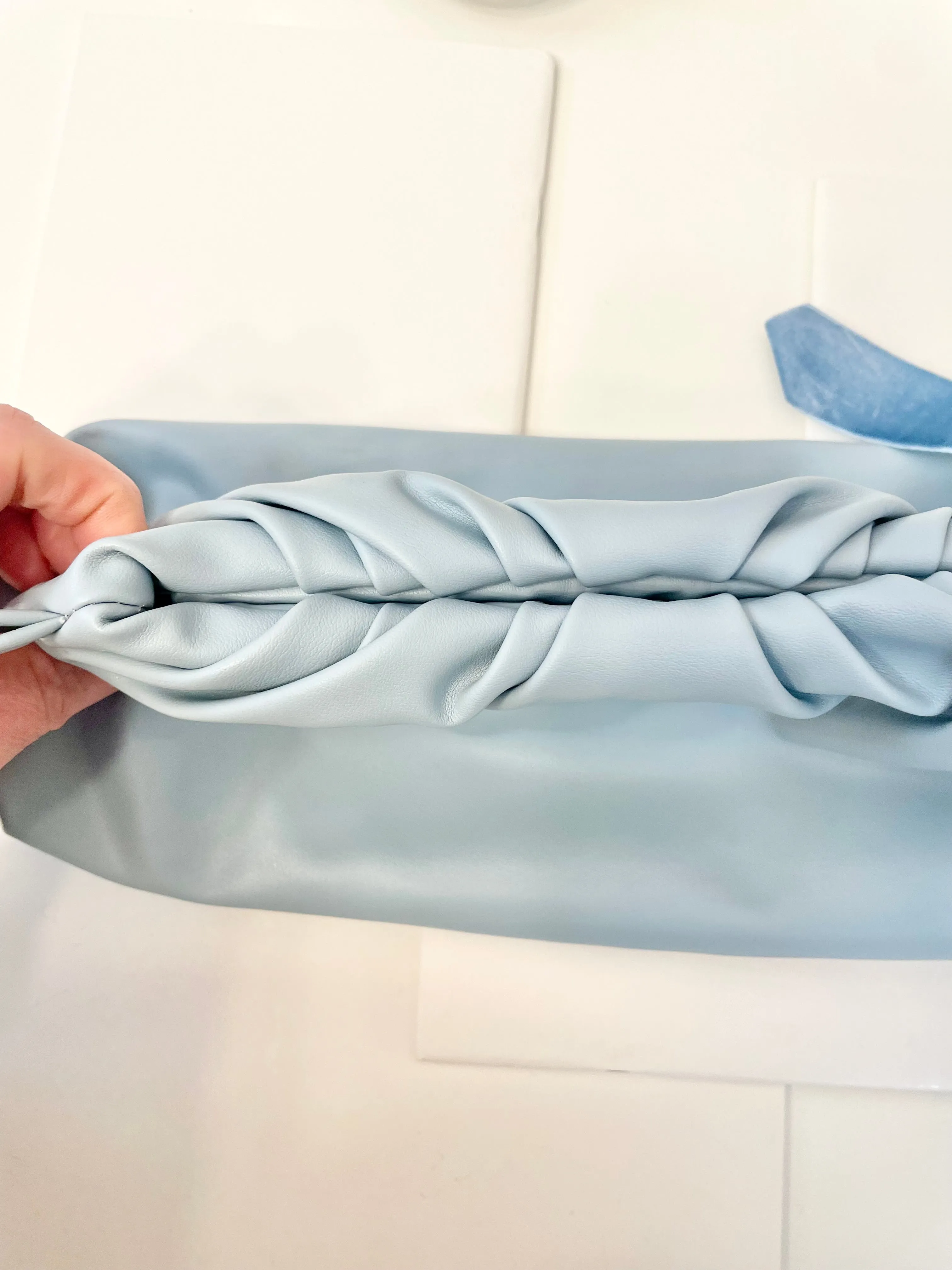 The most feminine soft blue tassel clutch bag... so lovely