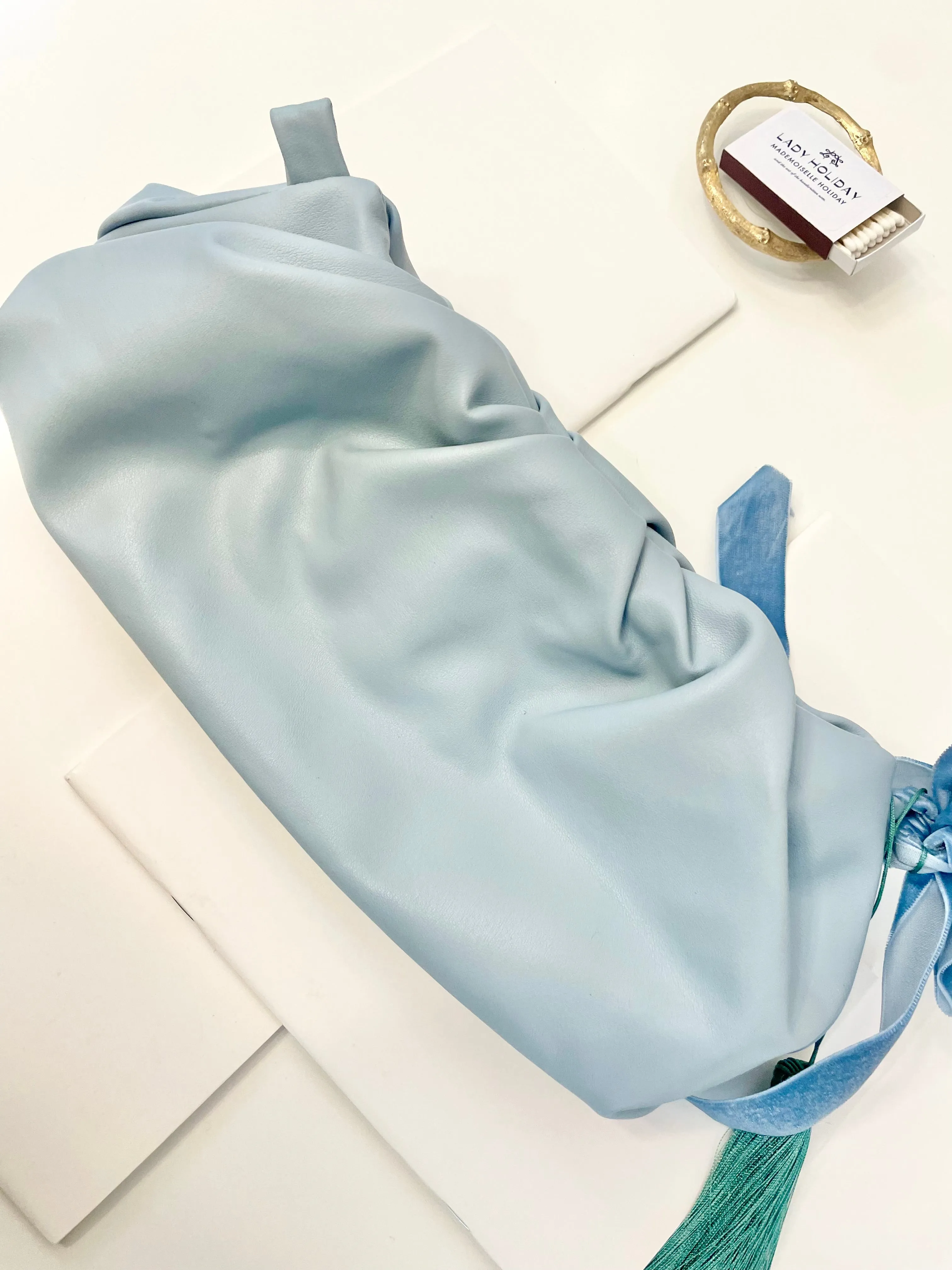 The most feminine soft blue tassel clutch bag... so lovely