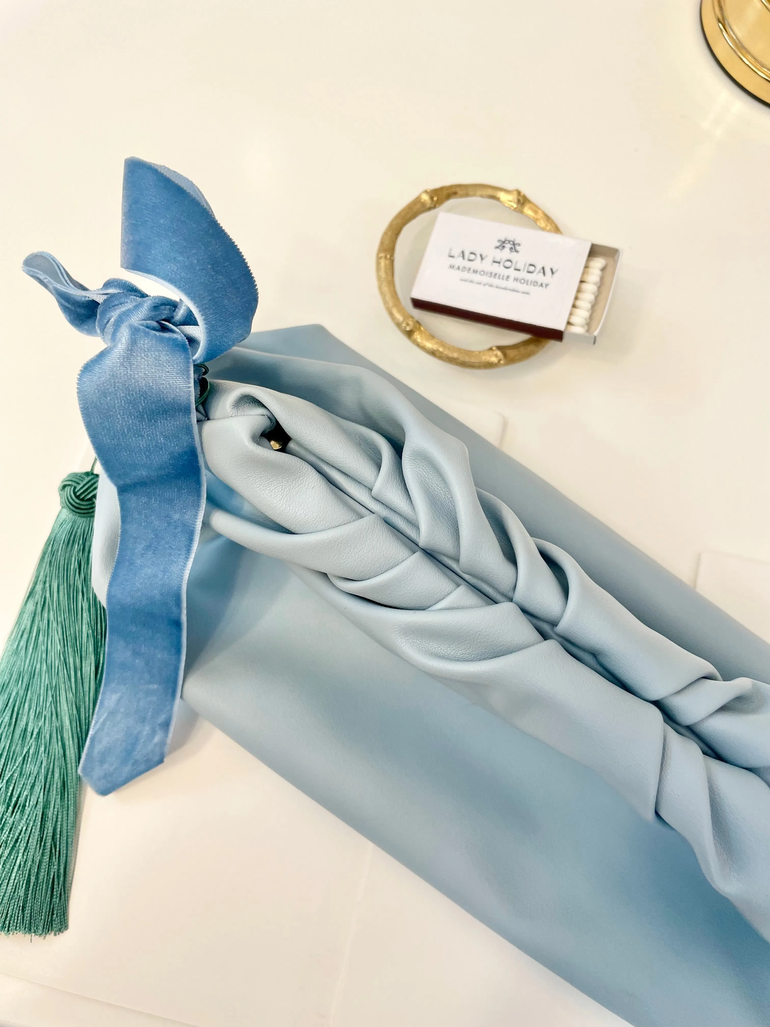 The most feminine soft blue tassel clutch bag... so lovely
